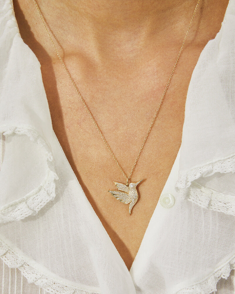 EF Collection 14k yellow gold hummingbird necklace with diamonds styled on neck of model