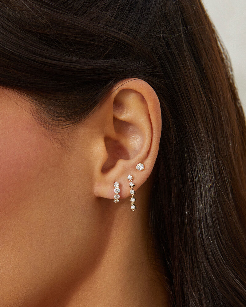 EF Collection 14k yellow gold earrings with diamond styled on ear of model