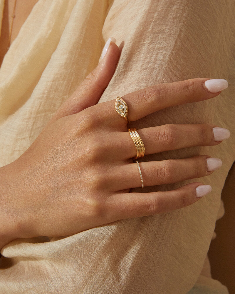 EF Collection 14k yellow gold rings styled on fingers of model