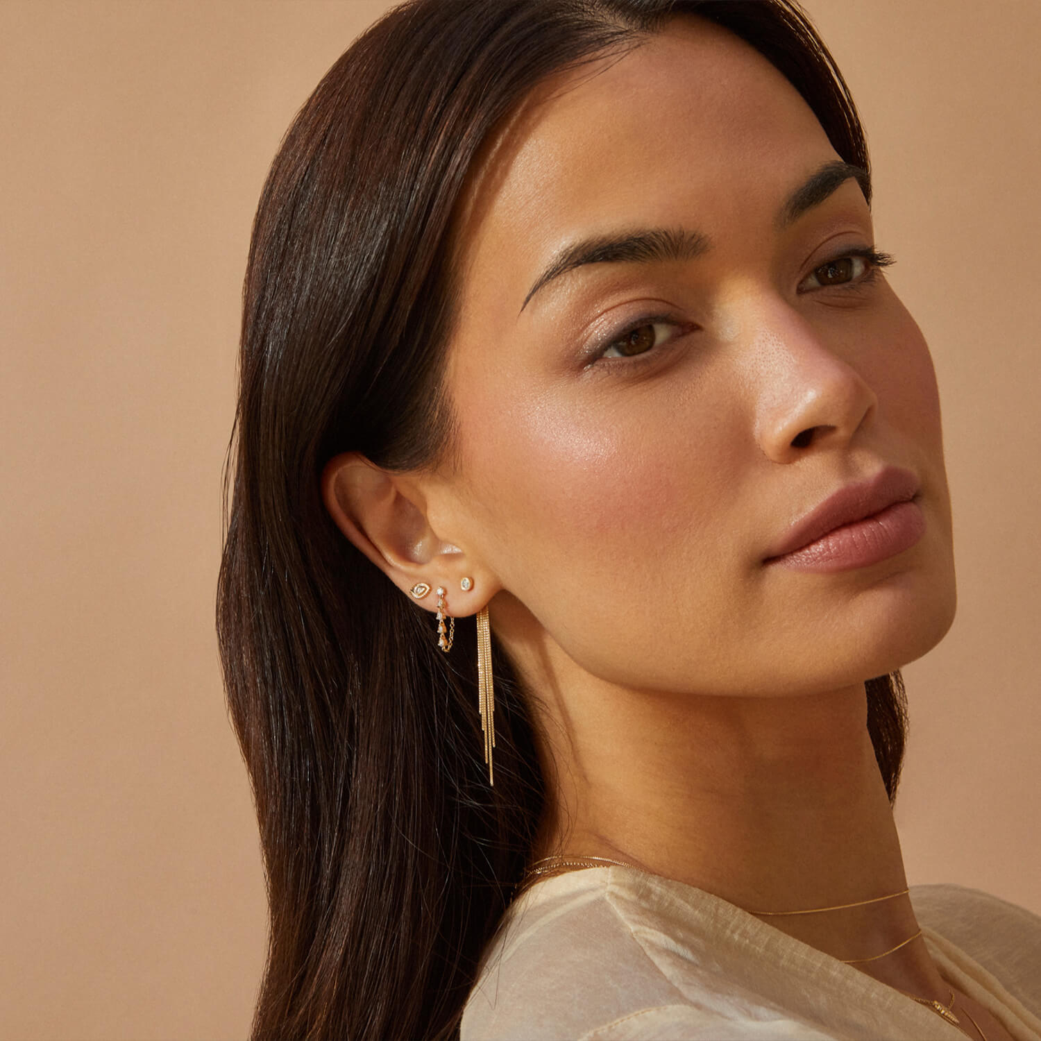EF Collection 14k yellow gold earrings styled on ear of model
