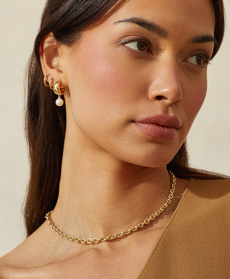 EF Collection 14k yellow gold earrings, necklace, and rings styled on model