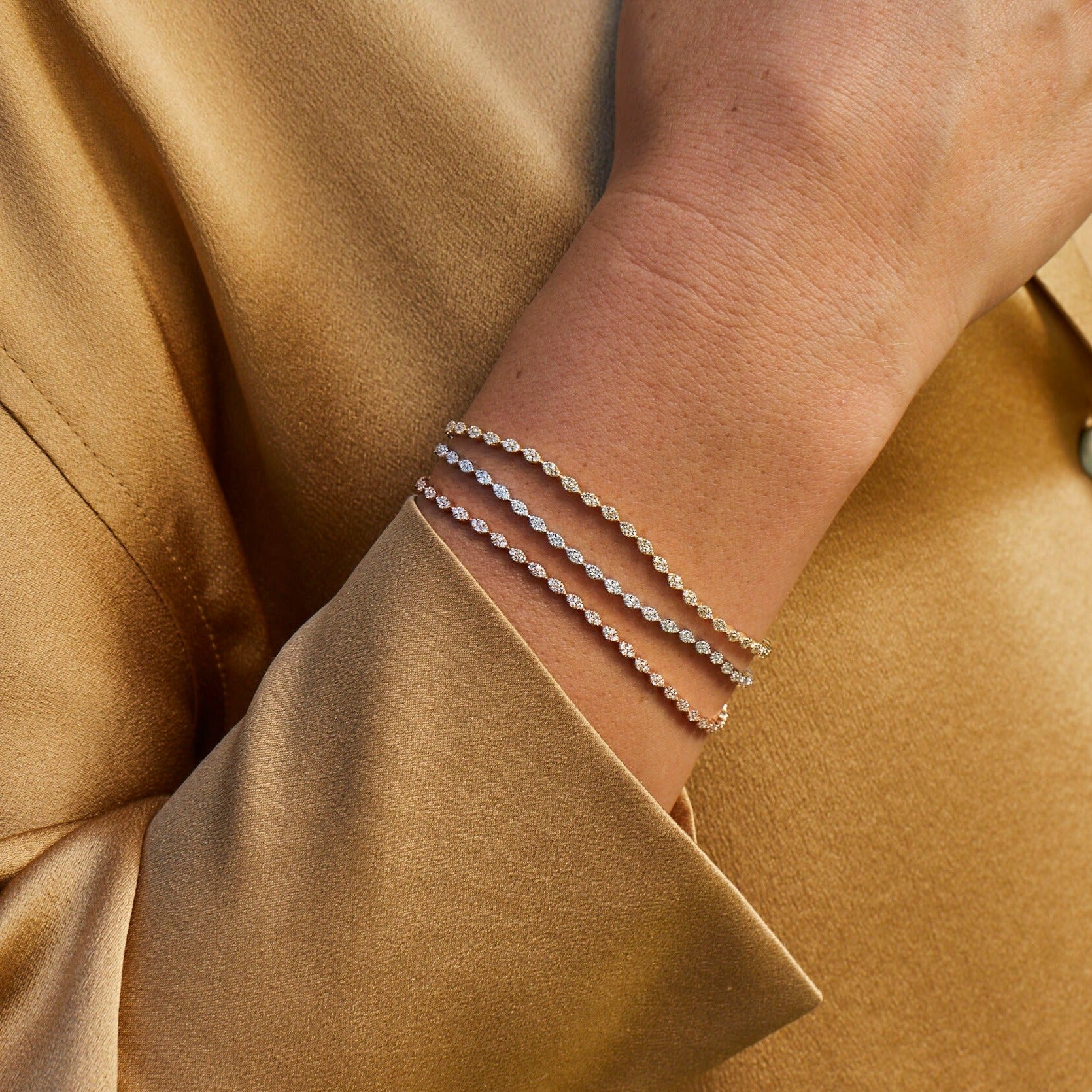 Pavé Diamond Marquise Eternity Bracelet styled on wrist of model in yellow gold, rose gold, and white gold