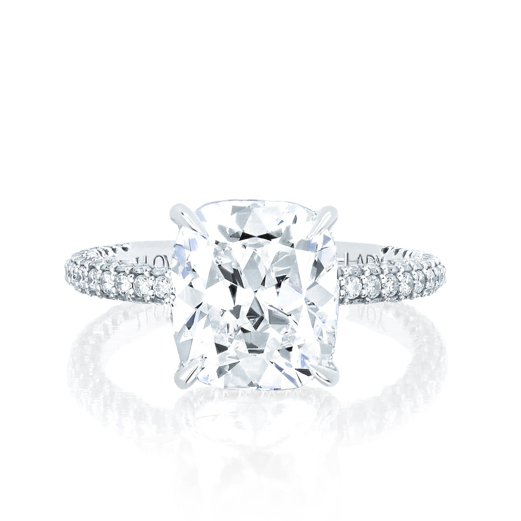 The Emily Engagement Ring with cushion cut center diamond with 3-sided micro pave diamonds on platinum band