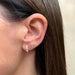 The Initial Set in 14k Yellow Gold Styled on Ear with E Initial Stud